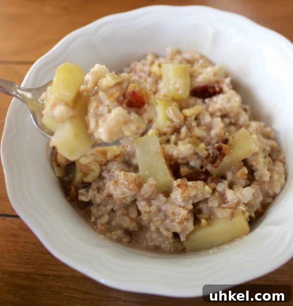 Packed with walnuts, raisins, and cinnamon, this apple pie oatmeal is healthy fall comfort food!