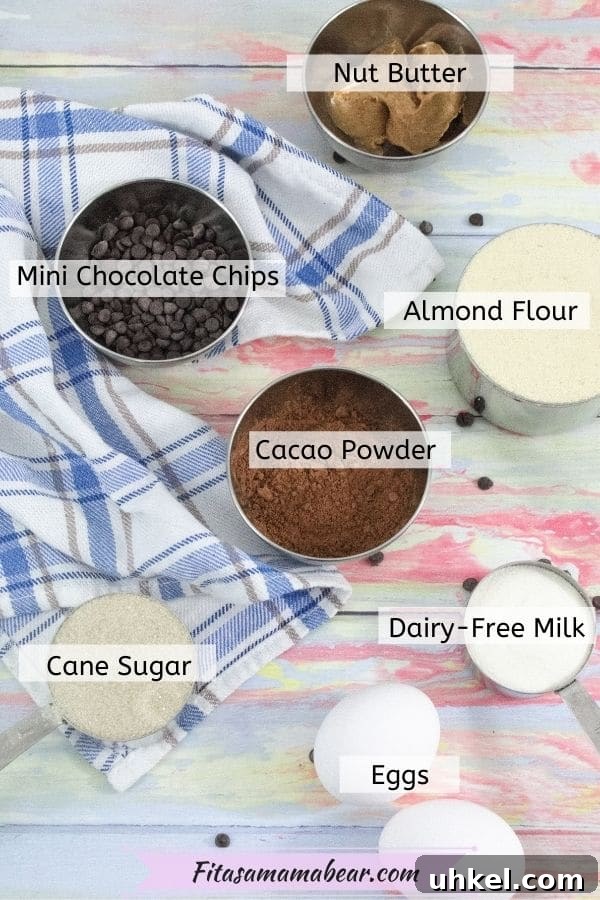 High-Protein Gluten-Free Brownies for Chocolate Lovers 3 Image of multiple ingredients like cacao powder, collagen, eggs, milk, and sugar in measuring cups all with a label over the ingredient.