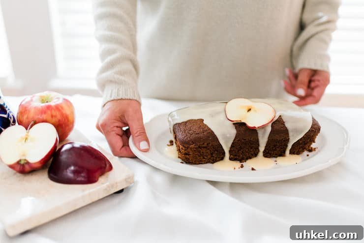 Moist Chocolate Loaf with Bourbon Glaze Recipe 7 a chocolate bread drizzled with bourbon glaze with apples on the table
