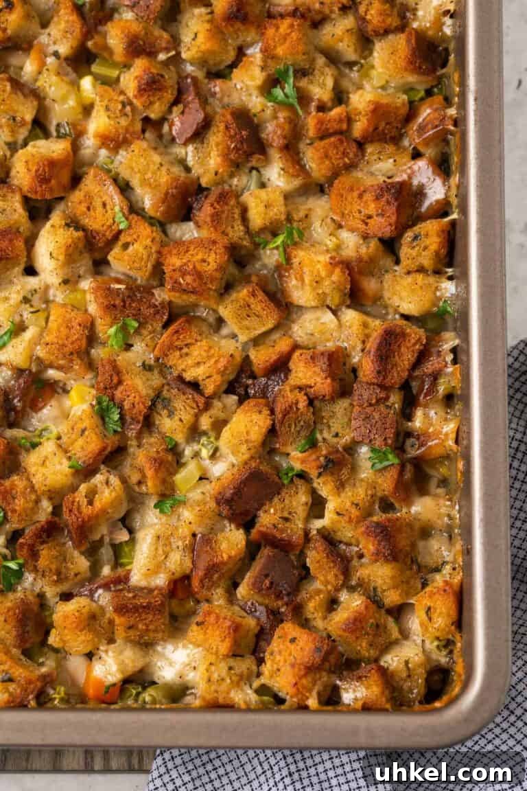 A baking dish with chicken casserole topped with stuffing. 