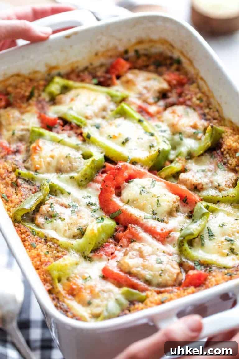 Stuffed peppers in a cheesy casserole with quinoa.