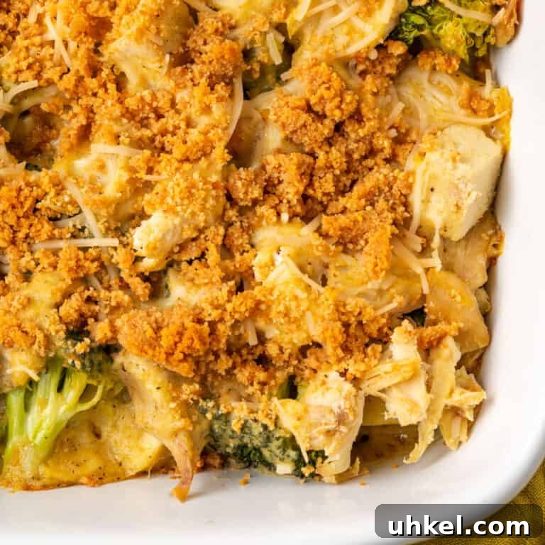 A ceramic casserole dish filled with chicken broccoli and potato casserole.