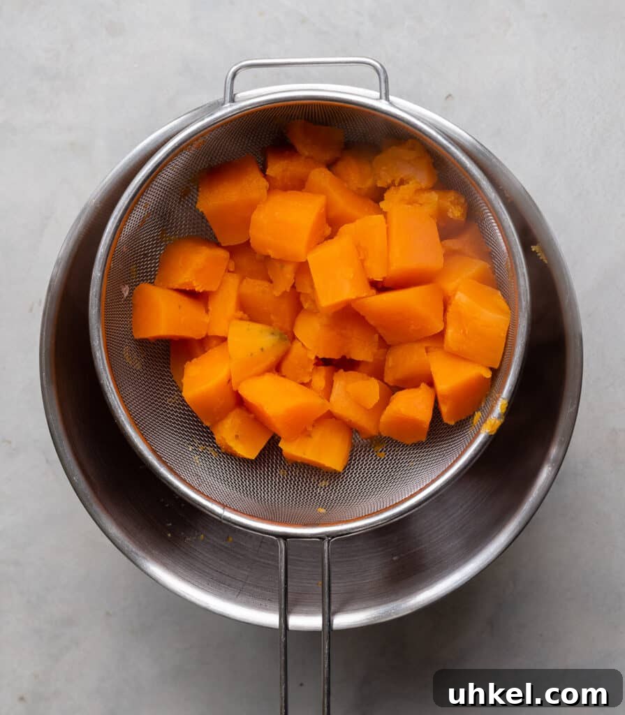 cooked sweet potatoes in a sieve