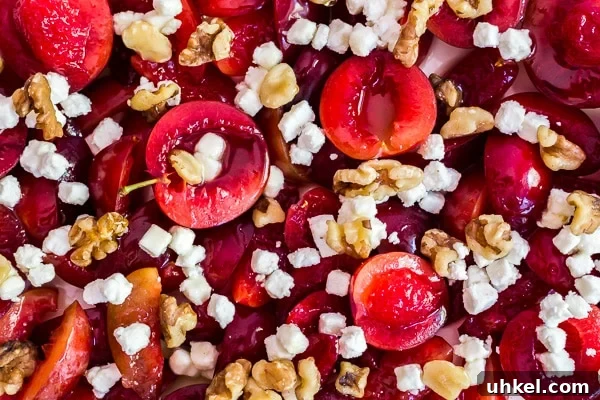 Roasted Plums with Goat Cheese and Toasted Walnuts 4 An upclose, overhead shot of plums with goat cheese and walnuts.