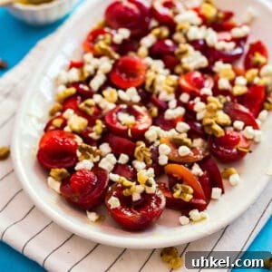 Roasted Plums with Goat Cheese and Toasted Walnuts 6 A square image of plums with goat cheese and walnuts.