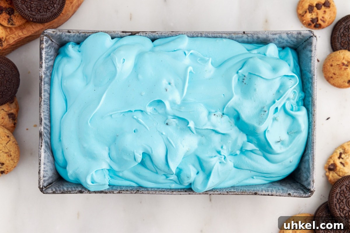 Ice cream mixture is transferred to a loaf pan.