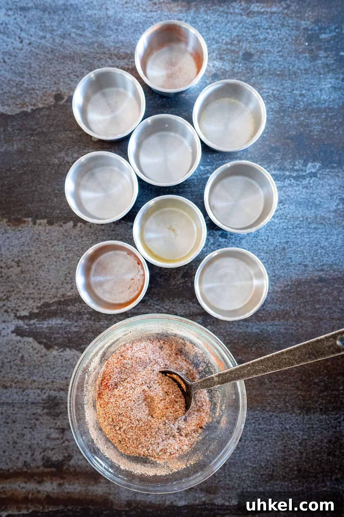Savory Homemade Dry Rub Recipe for Crispy Chicken Wings 4 Chicken wing dry rub ingredients mixed in small bowl.