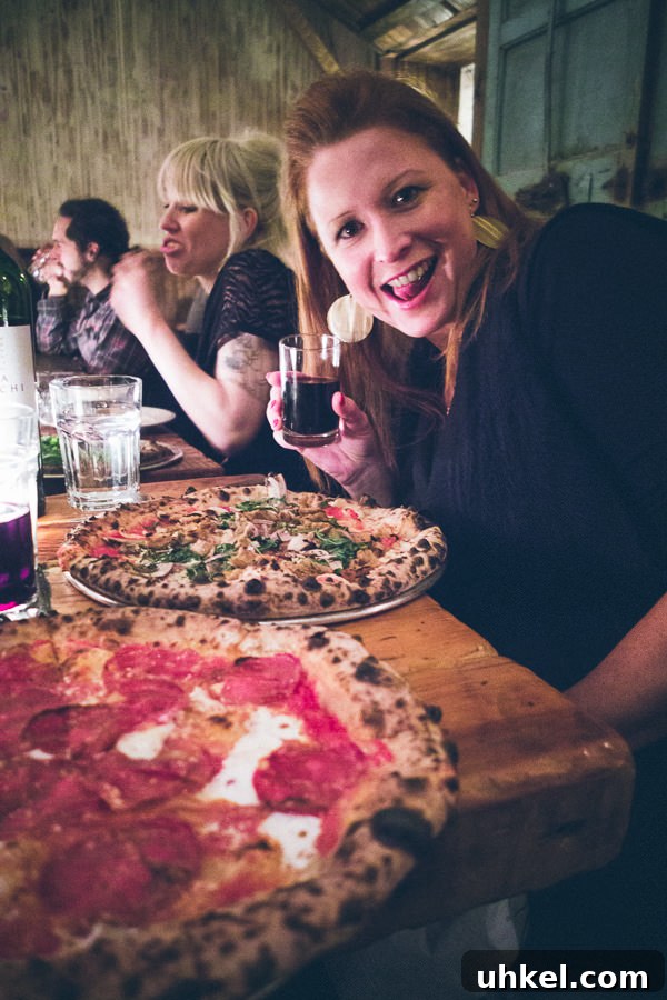 Is This New York’s Top Pizza Spot? 9 enjoying the pizza at Paulie Gees pizza Brooklyn New York