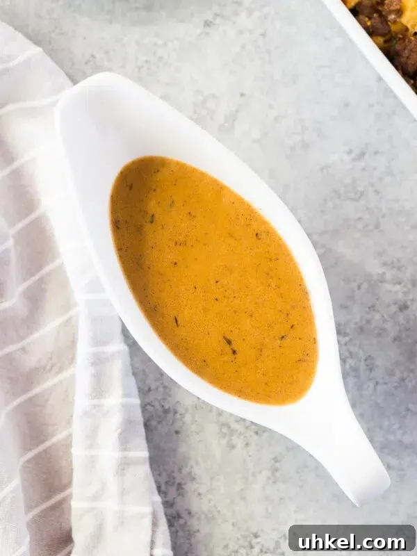 close up image of homemade gravy in a gravy boat