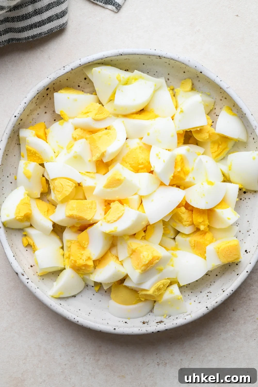 Creamy Deviled Egg Salad Recipe — Ready in 30 Minutes 8 How to make deviled egg salad: Hard boiled eggs chopped in a small ceramic bowl.