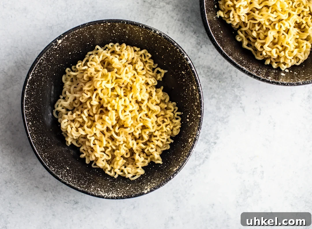Homemade Ramen Bowl Recipe: Savory Broth & Tasty Toppings 7 Overhead shot of bowl of cooked Ramen noodles.