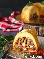 A front shot of sliced Neapolitan Sausage Meatballs and Rice Timbale