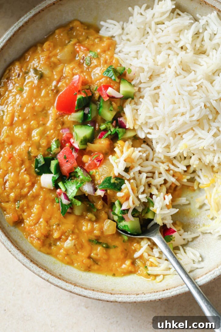 Authentic Masoor Dal (Red Lentil) Recipe for Perfect Flavor 2 Half-eaten bowl of Masoor dal and rice.
