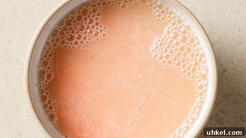 Authentic Masoor Dal (Red Lentil) Recipe for Perfect Flavor 22 Raw masoor dal soaked in a bowl of water.