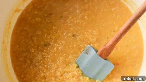 Authentic Masoor Dal (Red Lentil) Recipe for Perfect Flavor 25 Cooked Red lentil added to tarka dal.