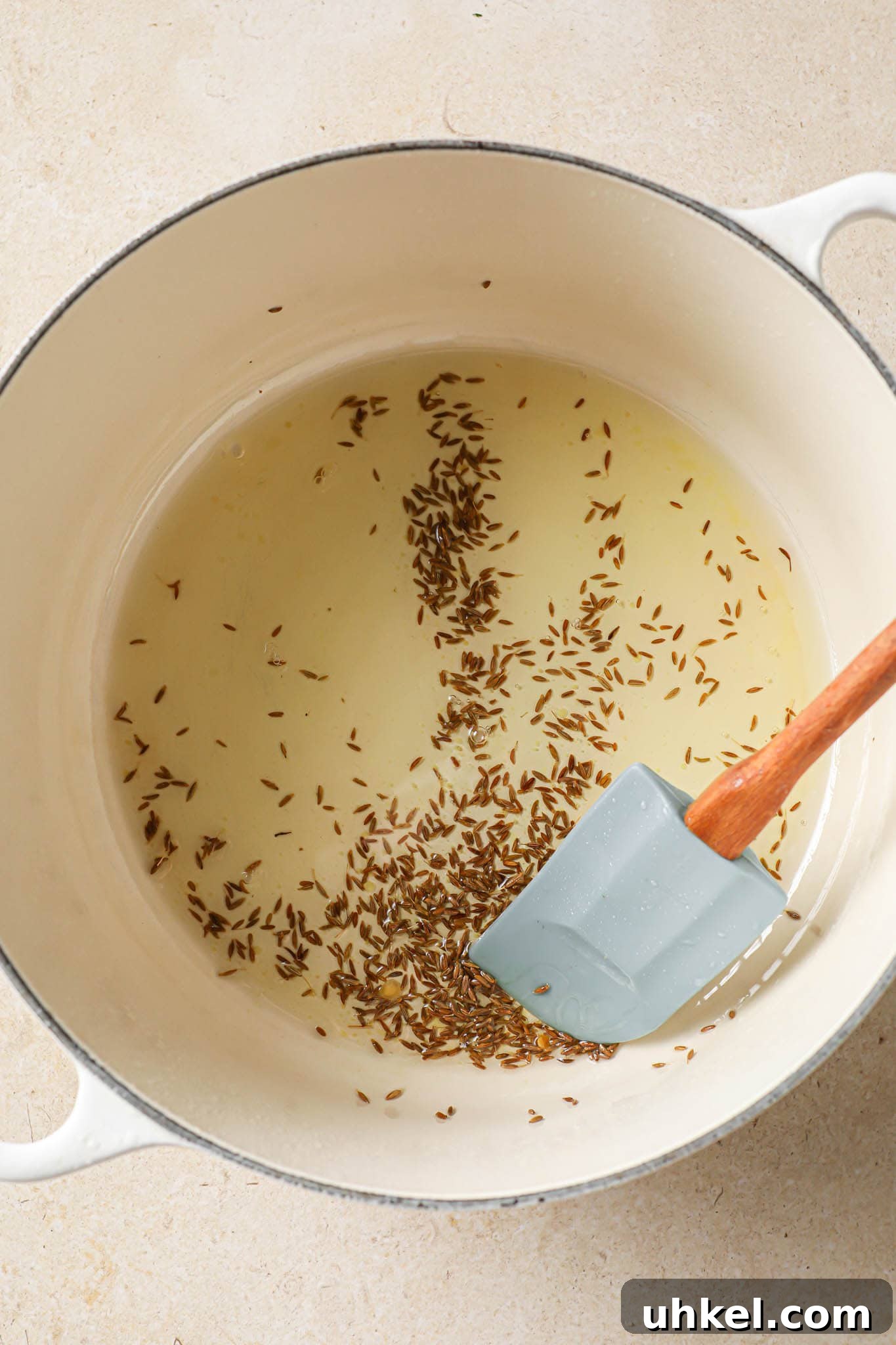 Authentic Masoor Dal (Red Lentil) Recipe for Perfect Flavor 10 Frying cumin seeds in oil in a Dutch oven.