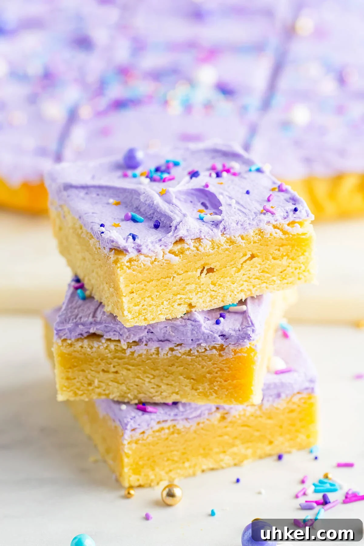 Chewy Frosted Sugar Cookie Bars: Simple Homemade Recipe 2 A stack of frosted sugar cookie bars