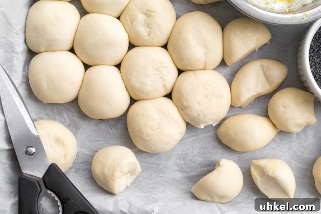 Lemon Poppy Seed Monkey Bread Recipe — Light Citrus Pull‑Apart Bread 4 frozen dinner rolls rising on a sheet pan