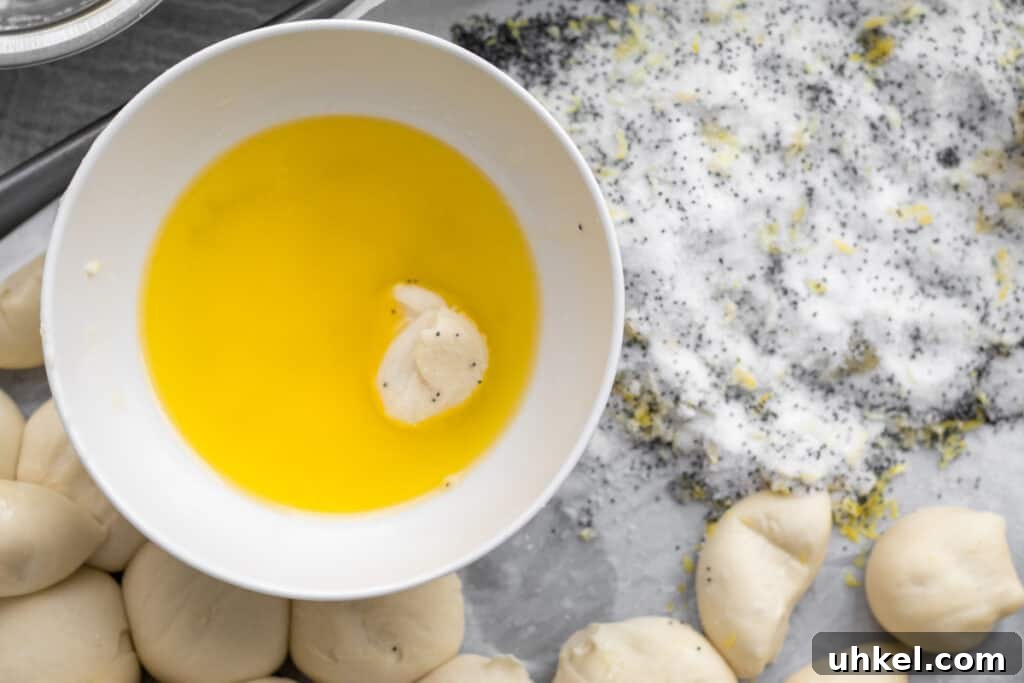 Lemon Poppy Seed Monkey Bread Recipe — Light Citrus Pull‑Apart Bread 7 melted butter with a dough ball in it