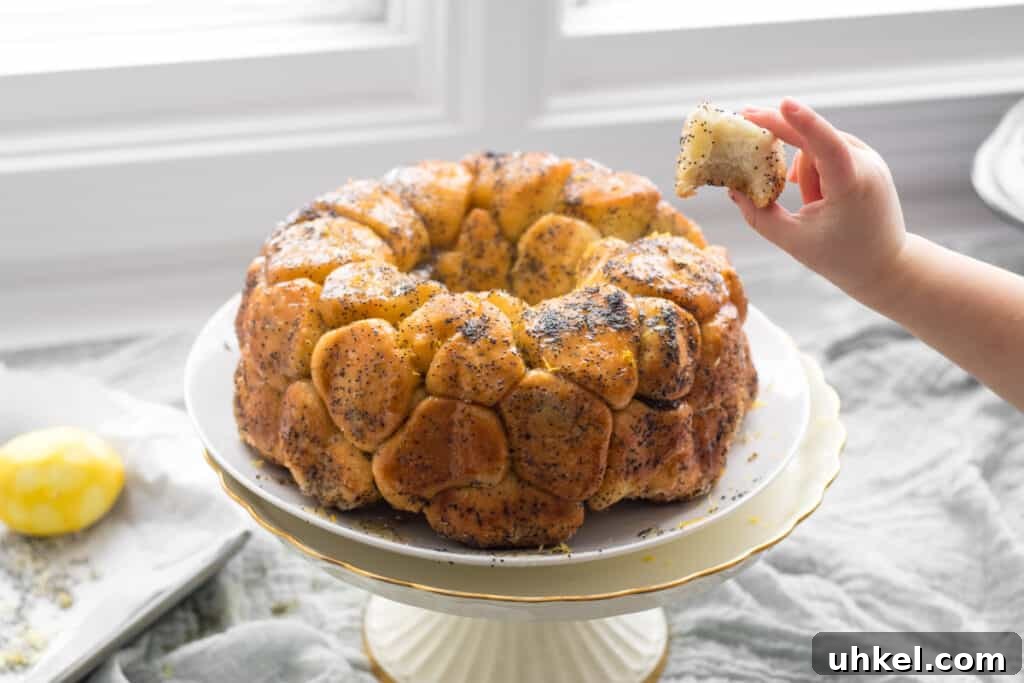 Lemon Poppy Seed Monkey Bread Recipe — Light Citrus Pull‑Apart Bread 9 little hand taking a piece of monkey bread