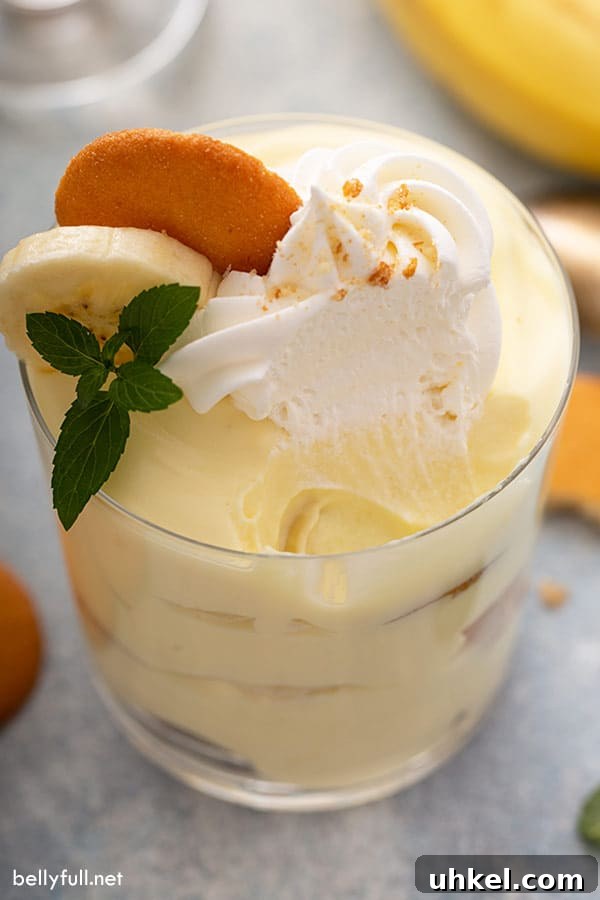 Homemade Banana Pudding Recipe with Creamy Vanilla Custard 3 glass of pudding with bite taken