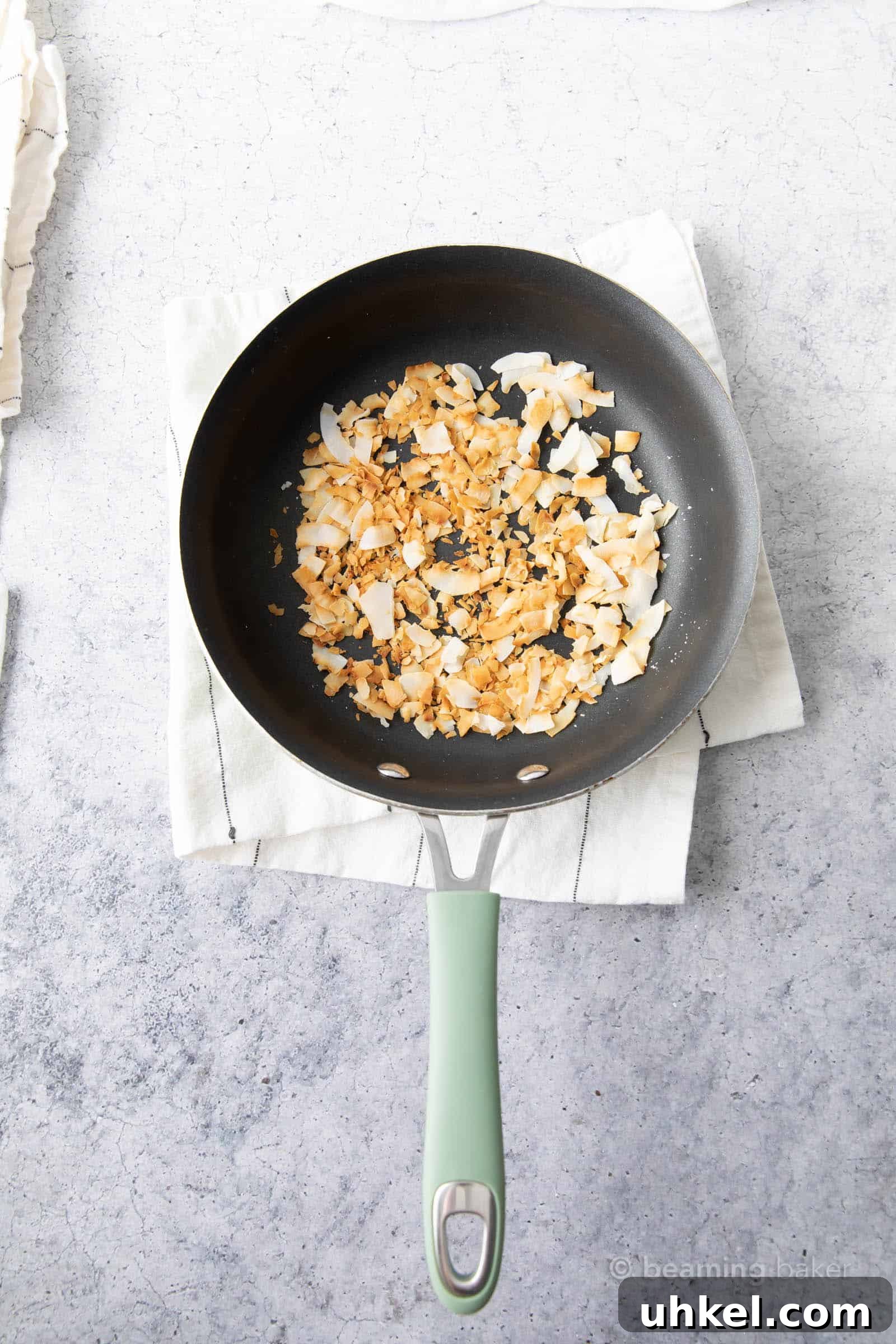 How to Toast Coconut Perfectly: Quick Oven and Stovetop Methods 5 after toasting photo of toasted coconut in pan