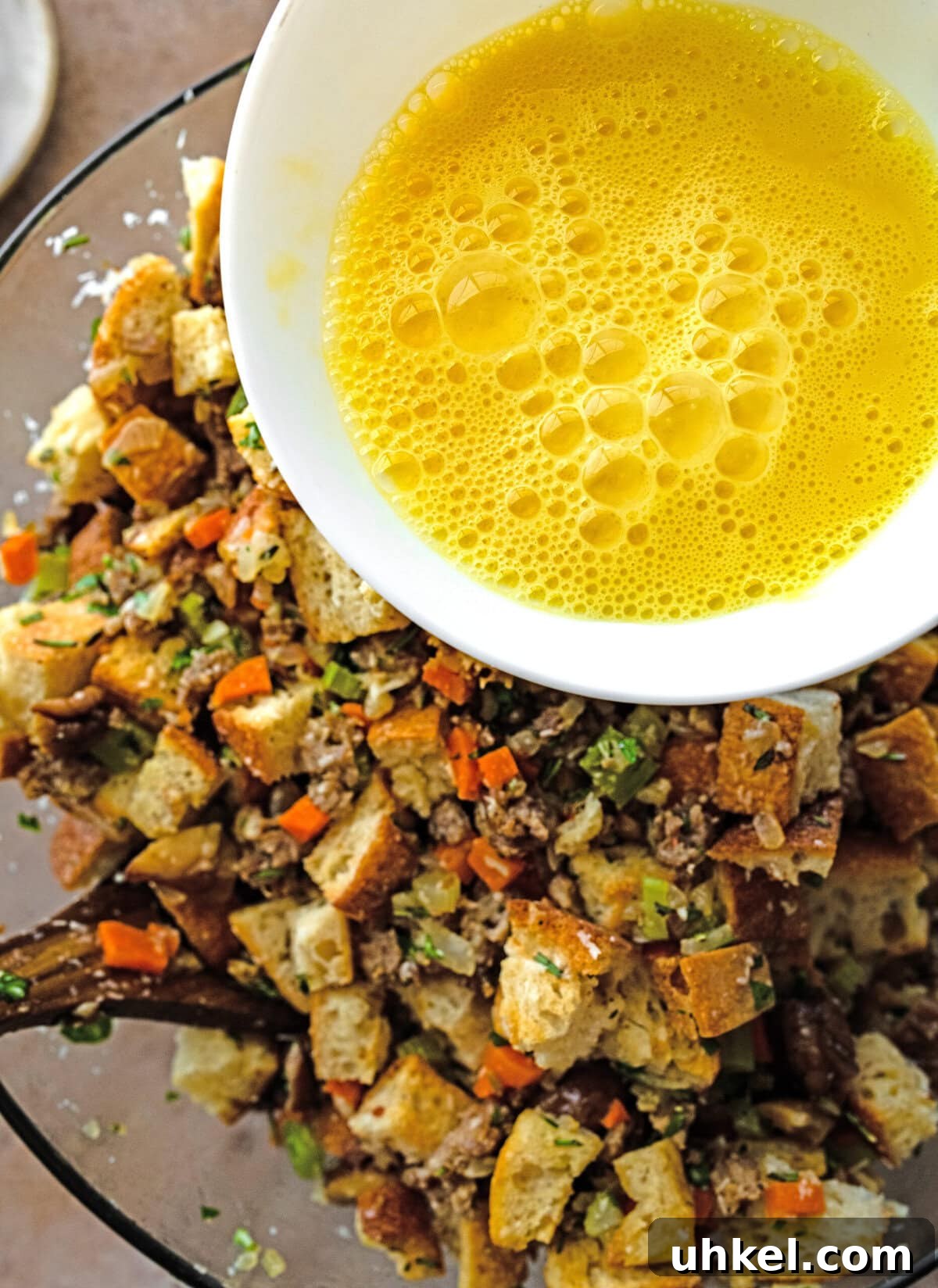 Sausage and Chestnut Ciabatta Stuffing Recipe for Holiday Tables 13 Add beaten egg to the bowl.