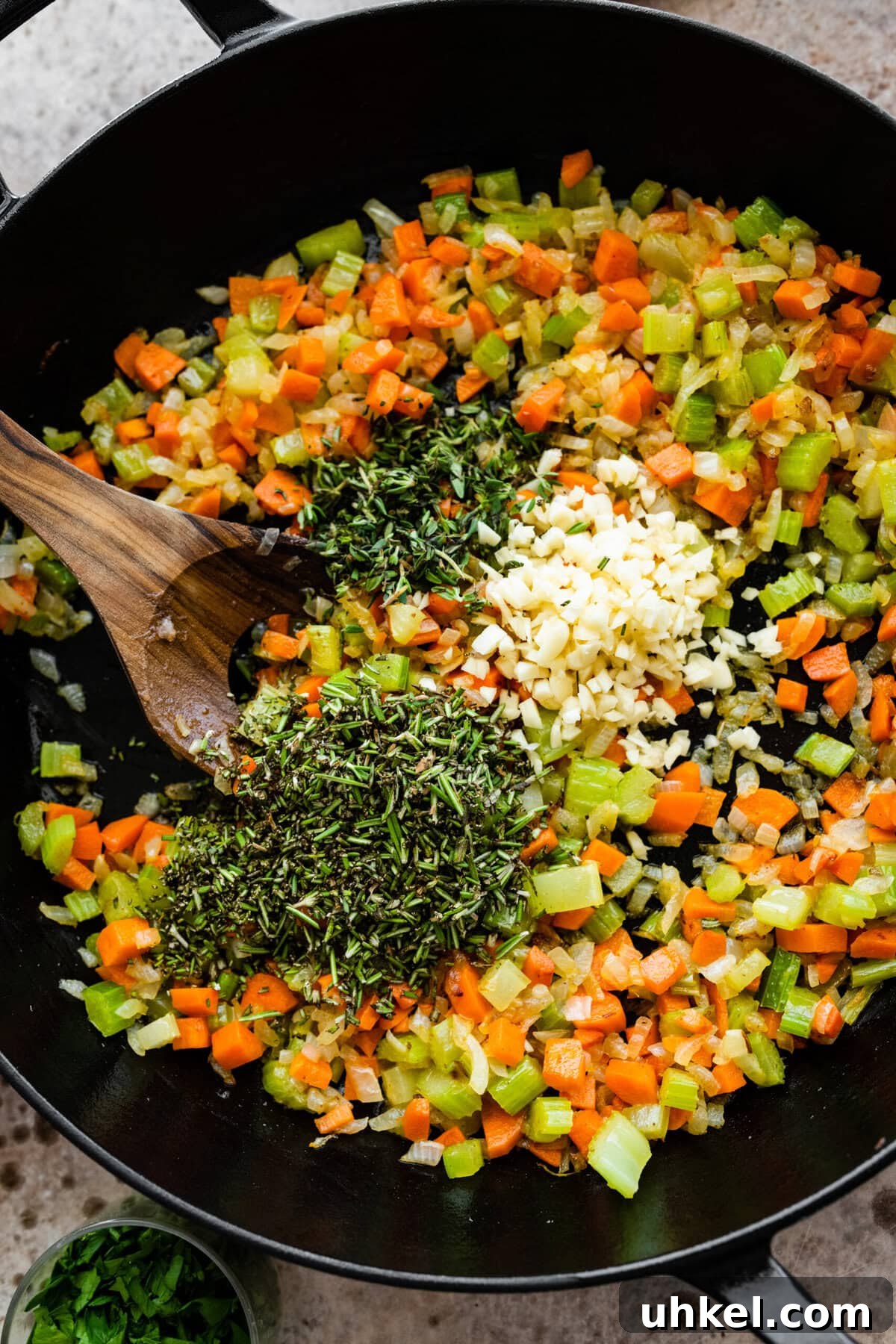 Sausage and Chestnut Ciabatta Stuffing Recipe for Holiday Tables 10 Adding herbs and garlic to the veggies.
