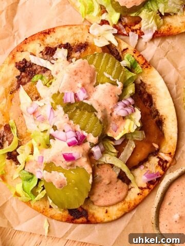 Smashburger tacos on a wooden cutting board.