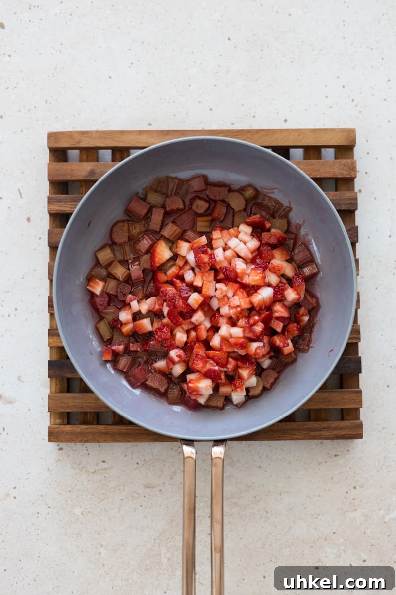 Strawberry Rhubarb Compote Panna Cotta (Dairy-Free) 6 Rhubarb and strawberries in a small skillet.