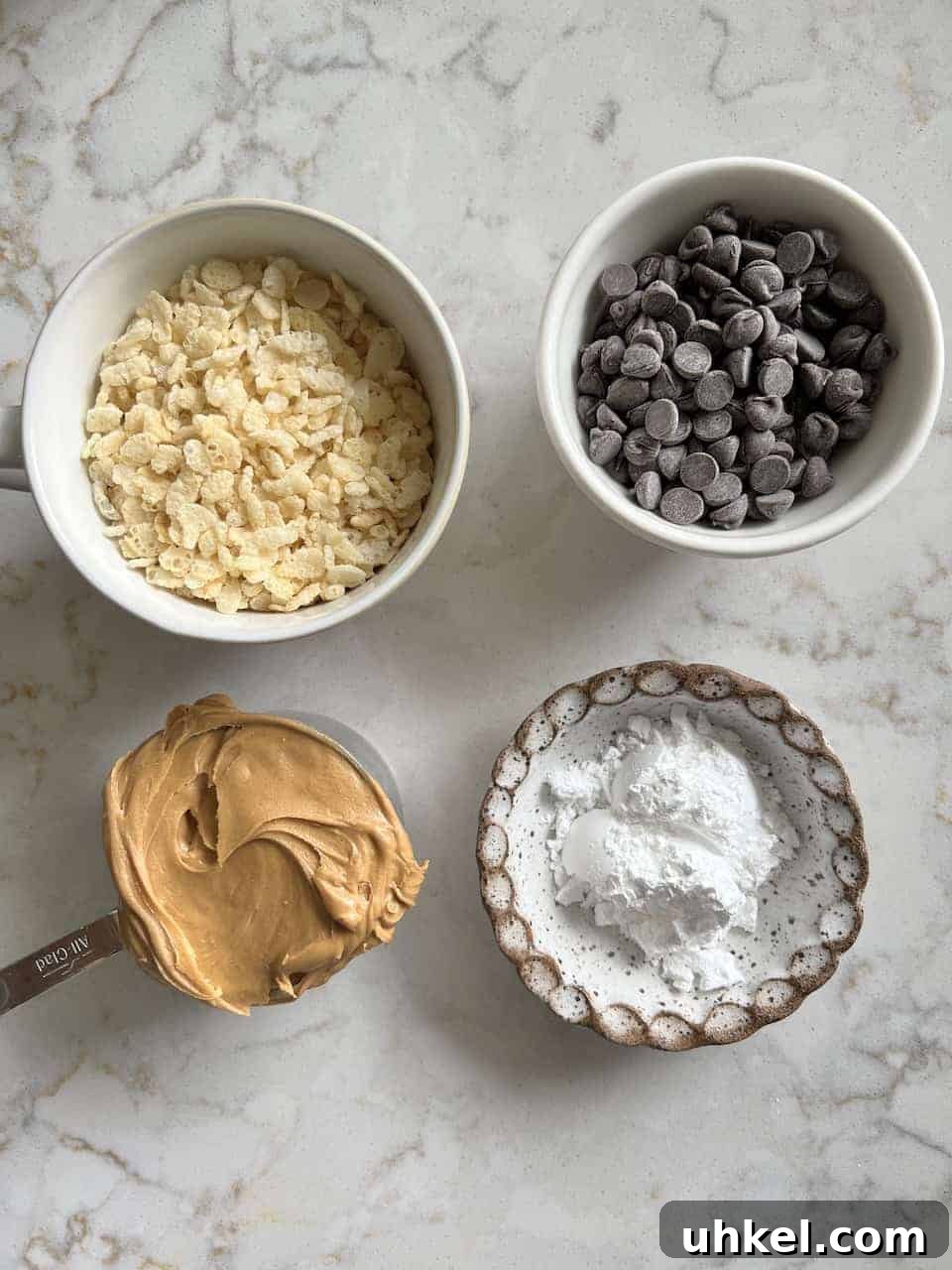 Vegan No-Bake Chocolate Peanut Butter Krispie Balls 4 ingredients for Peanut Butter Bon Bons on a marble white surface