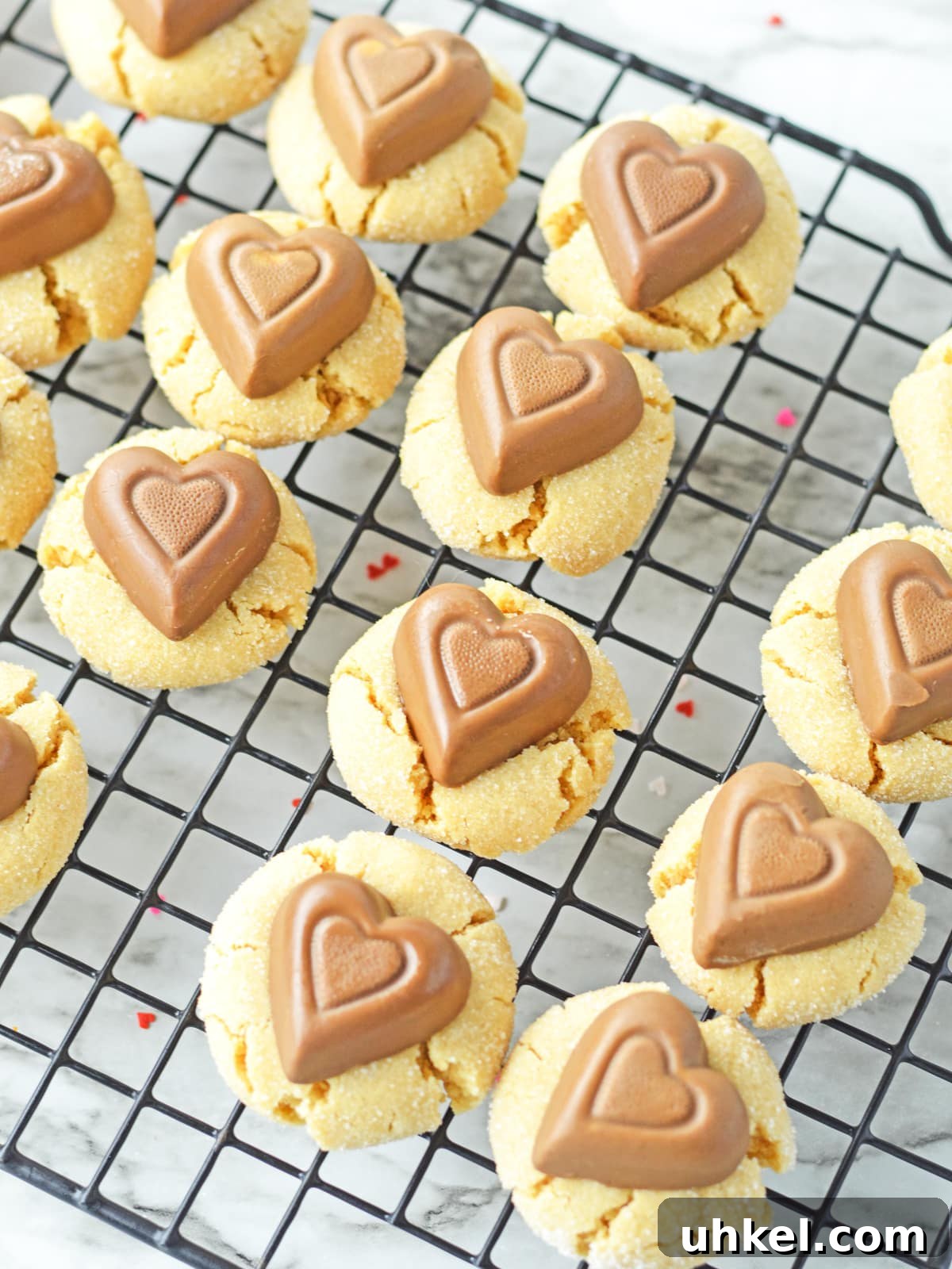 Peanut Butter Blossom Cookies for a Valentine’s Day Treat 6 press chocolate peanut butter hearts into warm cookies