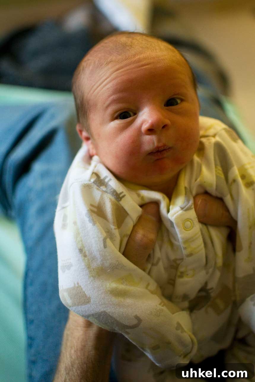 Meet Benjamin James: Award-Winning Photographer & Creative Director 4 A person holding up a young baby.