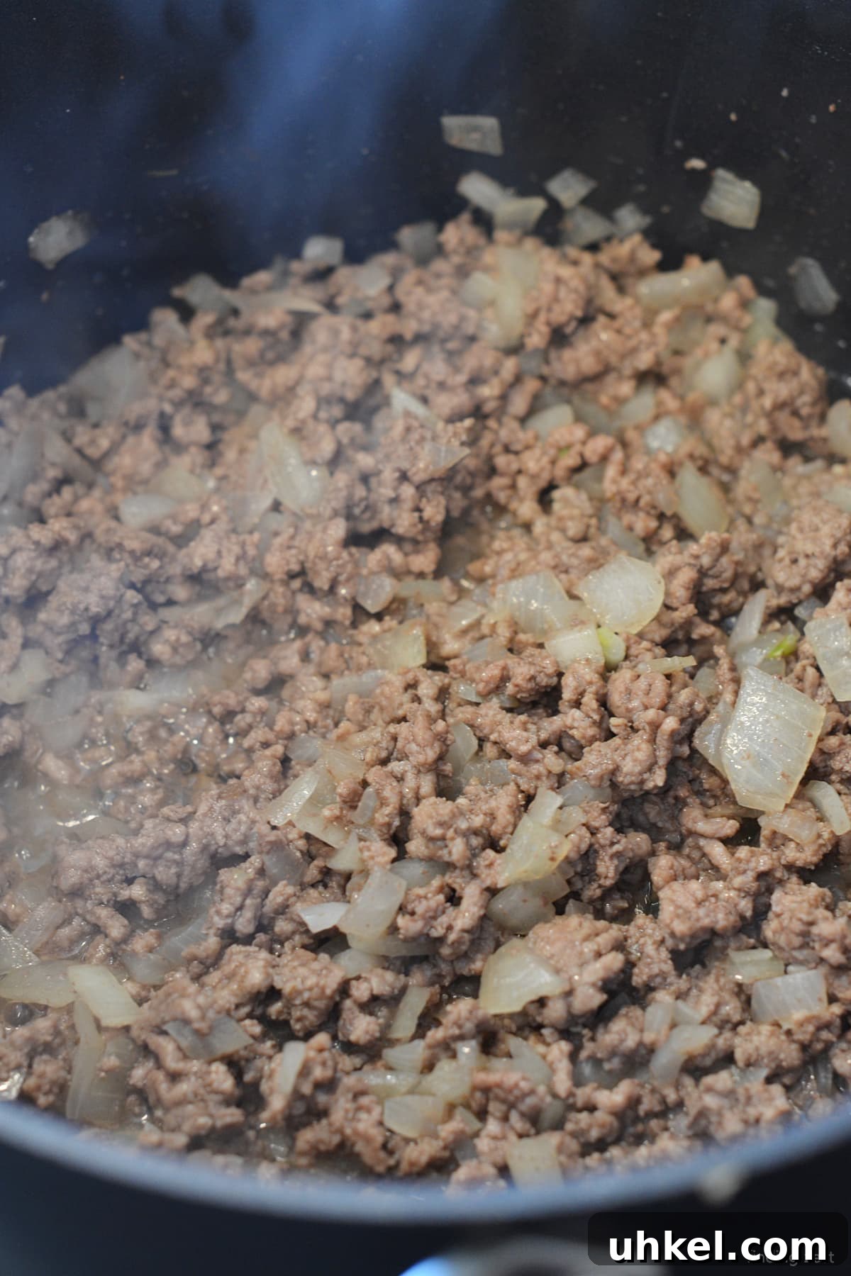 Hearty 7-Can Taco Soup Recipe for Quick Weeknight Dinners 6 Browning hamburger and onion in a pot