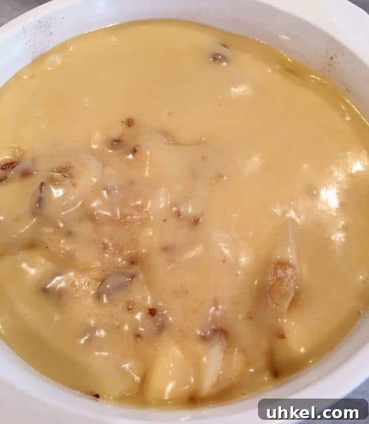Apple Pecan Cobbler Recipe: Warm Spiced Filling with Crisp Topping 7 apple batter poured over apples in baking dish