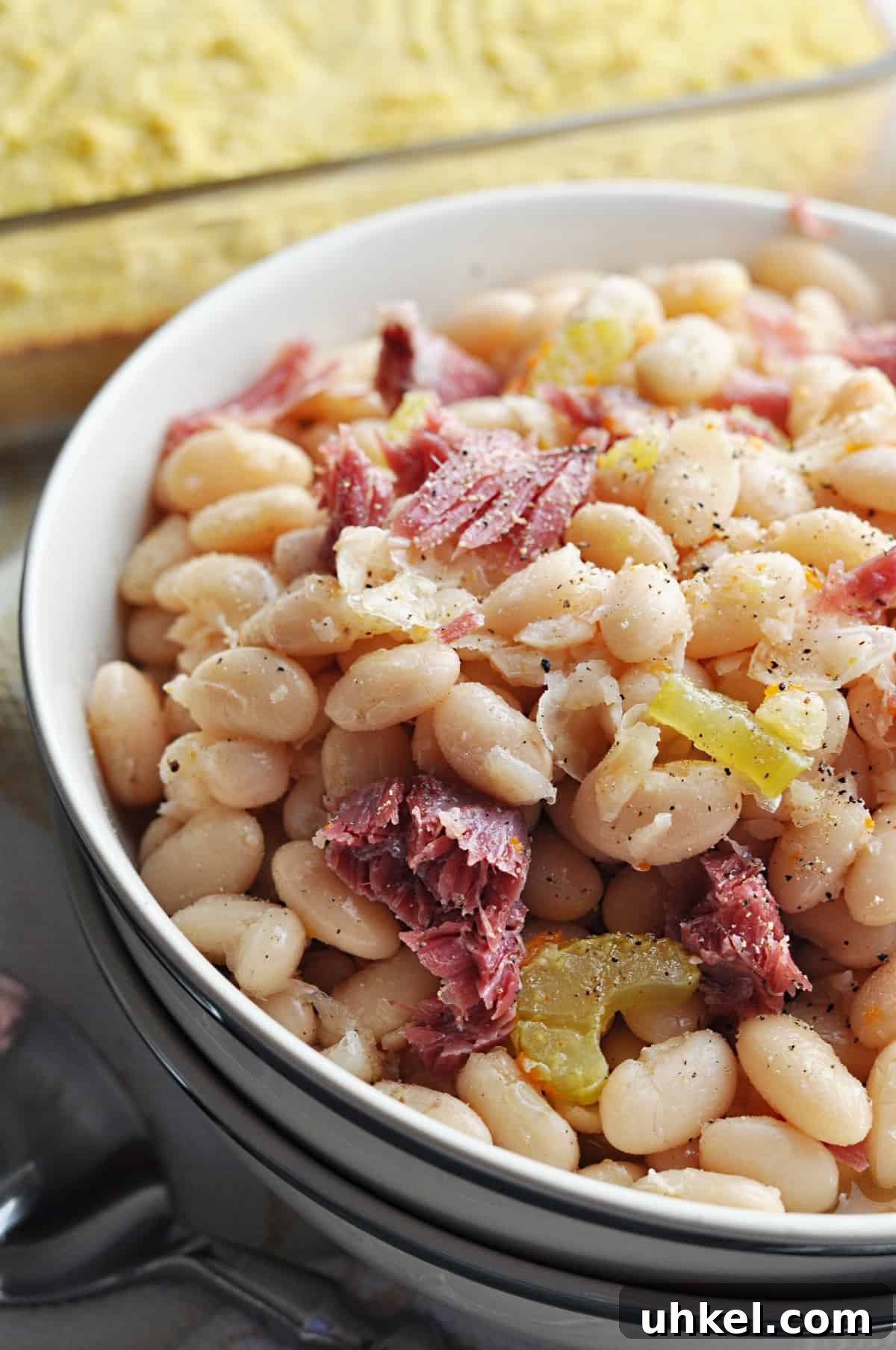 Southern-Style Crock Pot Great Northern Beans Recipe 2 Great northern beans with ham close up in bowl