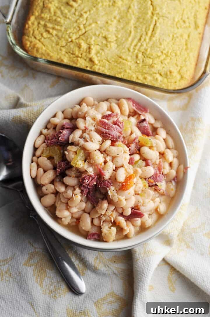 Southern-Style Crock Pot Great Northern Beans Recipe 3 Beans with ham and carrots overhead shot in bowl