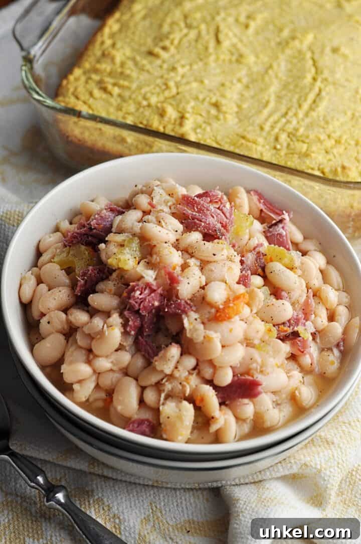 Southern-Style Crock Pot Great Northern Beans Recipe 5 White beans in a bowl served with corn bread