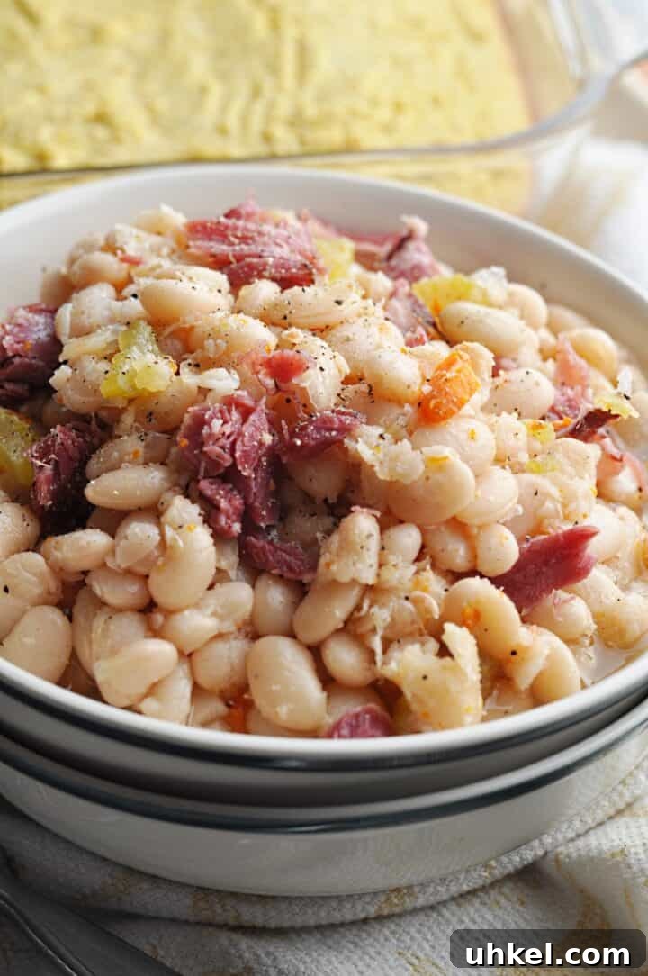 Southern-Style Crock Pot Great Northern Beans Recipe 6 White beans with ham and carrots in bowl