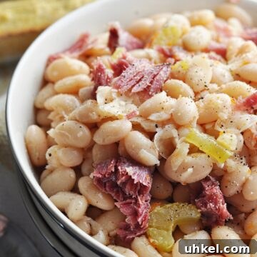 Southern-Style Crock Pot Great Northern Beans Recipe 7 Great northern beans with ham close up in bowl