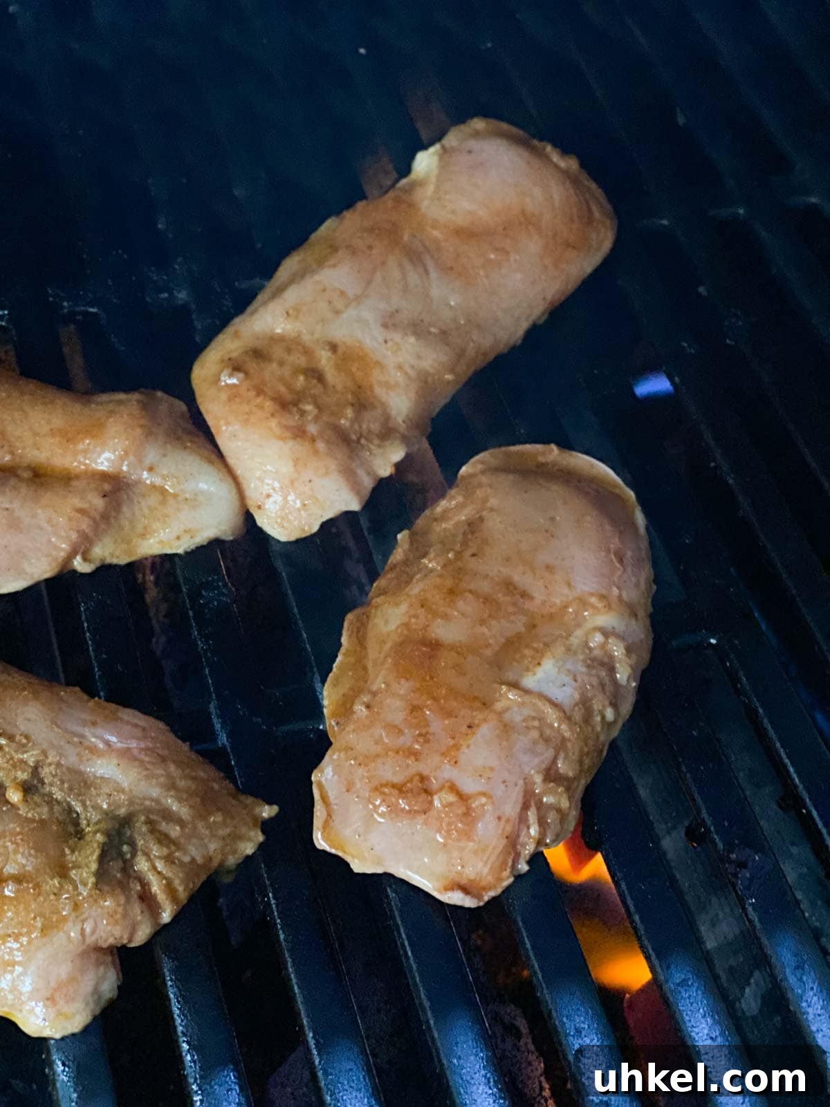 Juicy Mexican-Style Grilled Chicken with Zesty Marinade 7 Raw chicken placed on grill.