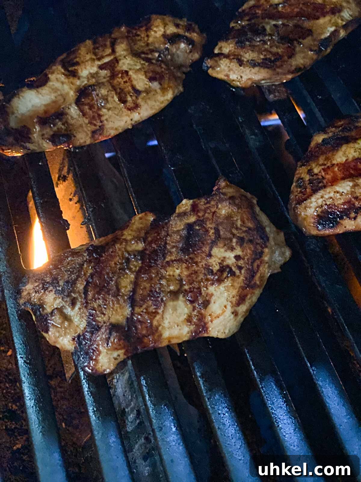 Juicy Mexican-Style Grilled Chicken with Zesty Marinade 8 Grilled chicken showing grill marks.