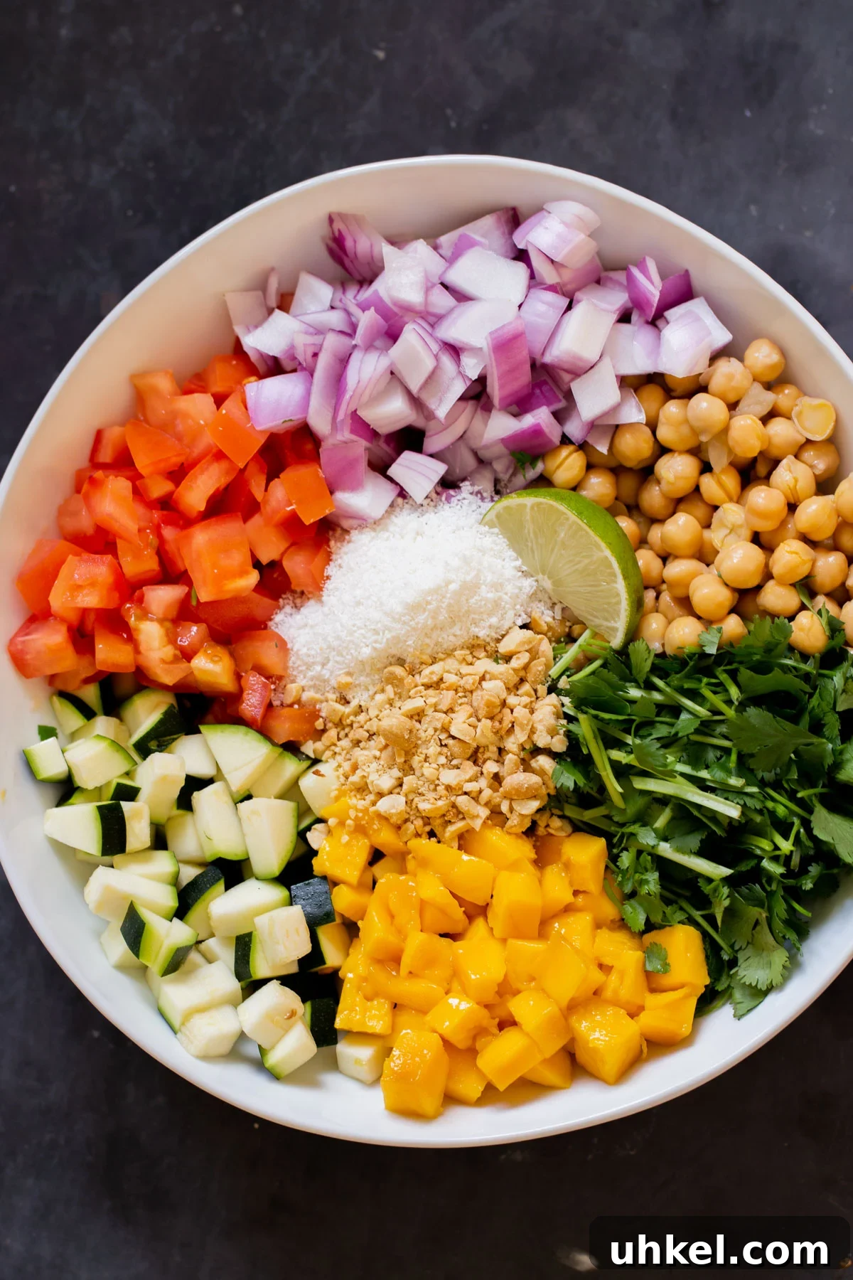 Mango, Chickpea & Zucchini Koshimbir Salad with Curry Leaves 3 koshimbir salad ingredients in the bowl before mixing