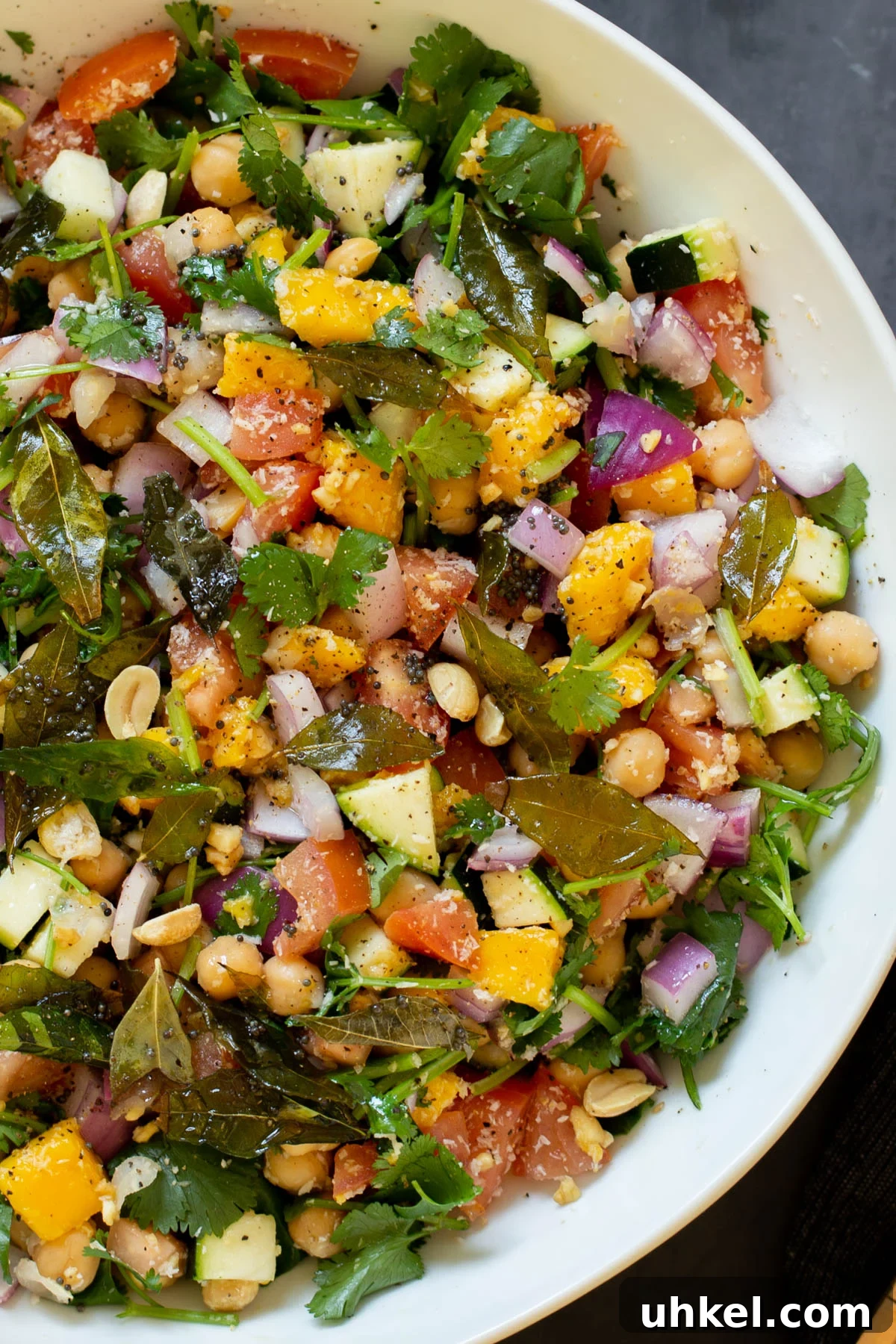 Mango, Chickpea & Zucchini Koshimbir Salad with Curry Leaves 4 close-up of zucchini koshimbir salad in a serving bowl