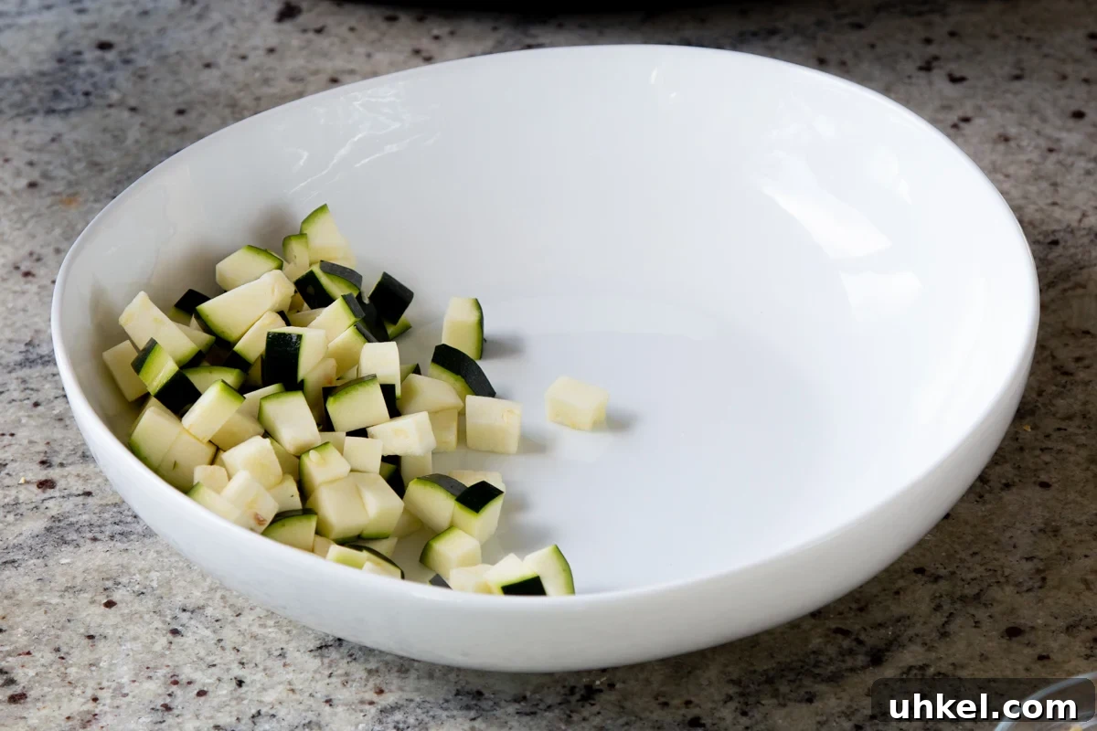 Mango, Chickpea & Zucchini Koshimbir Salad with Curry Leaves 8 chopped zucchini in a bowl