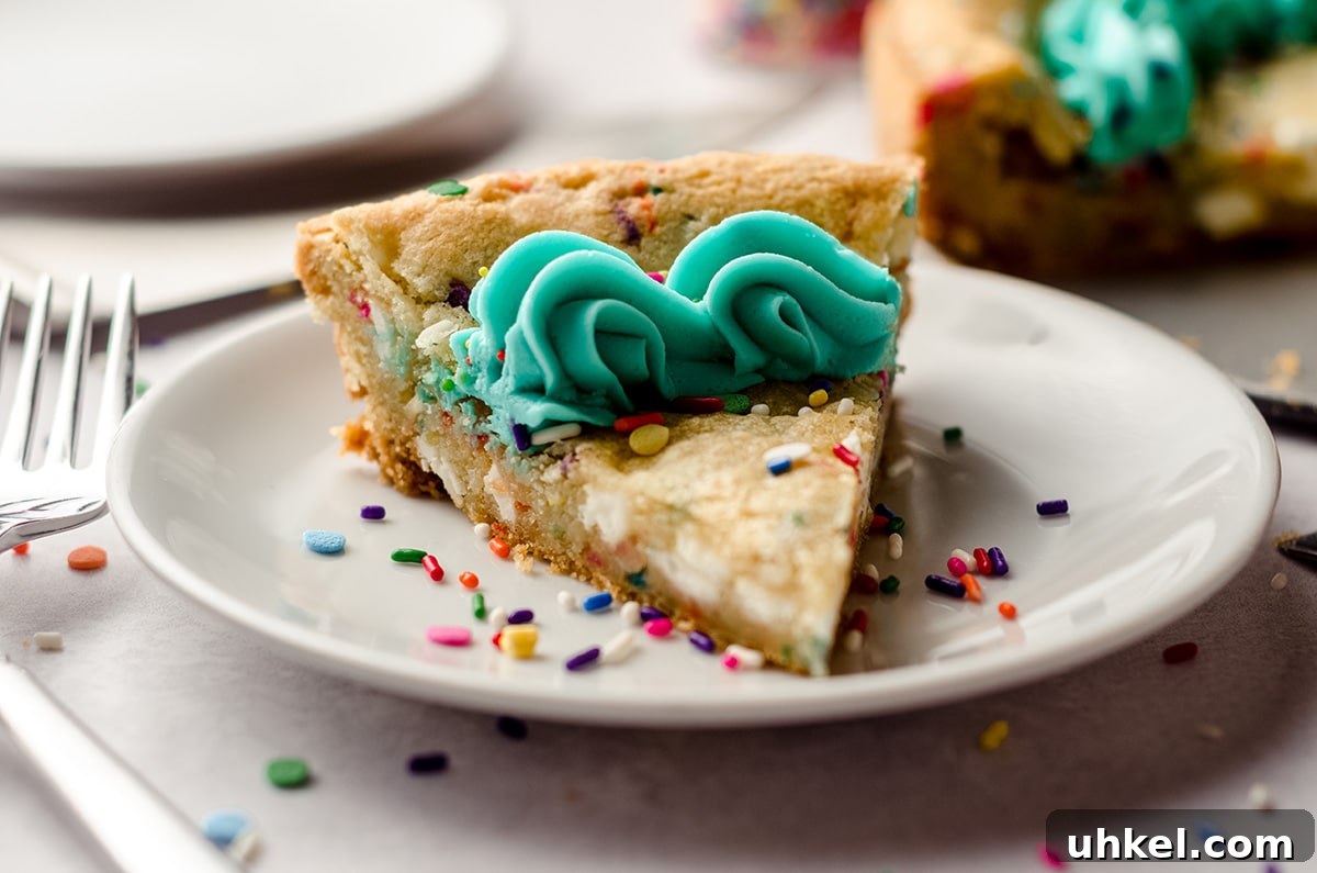 a slice of funfetti sugar cookie cake on a plate