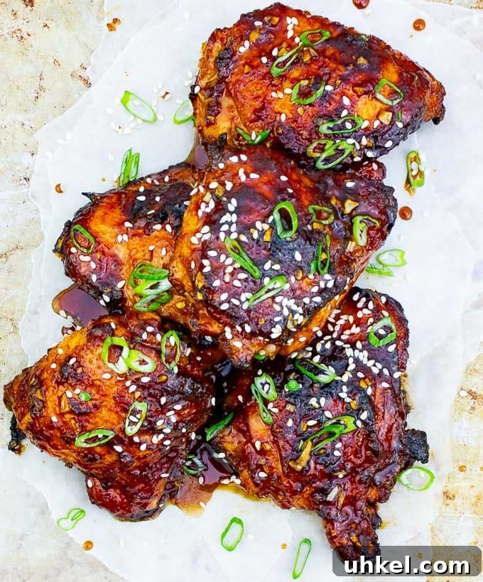 Sticky Asian-Style Grilled Chicken Thighs with Sweet Glaze 2 Sticky Asian Grilled Chicken Thighs on white background