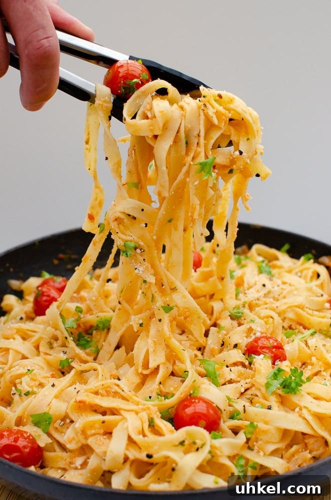 Crab Tagliatelle with Shredded Crab and Lemon Herb Sauce 9 Picking up our Flawless Shredded Crab Tagliatelle with black and silver tongs