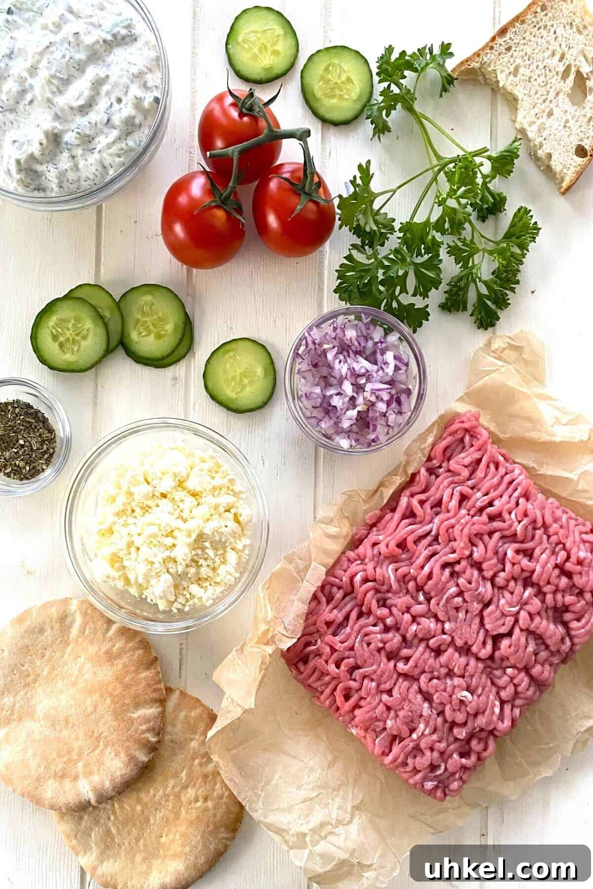 Mini Greek Turkey Sliders with Cucumber Tzatziki 3 ground turkey, chopped onion, cucumber, tomatoes, feta cheese, pita bread.