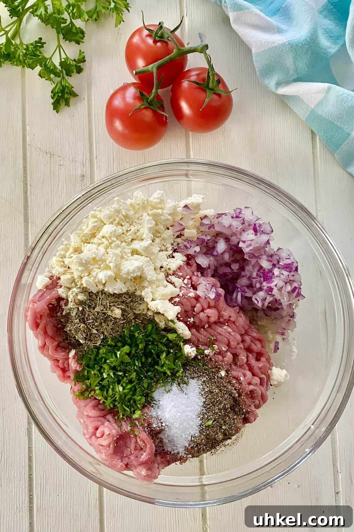 Mini Greek Turkey Sliders with Cucumber Tzatziki 5 ground turkey, parsley, feta, and chopped onions in a bowl.